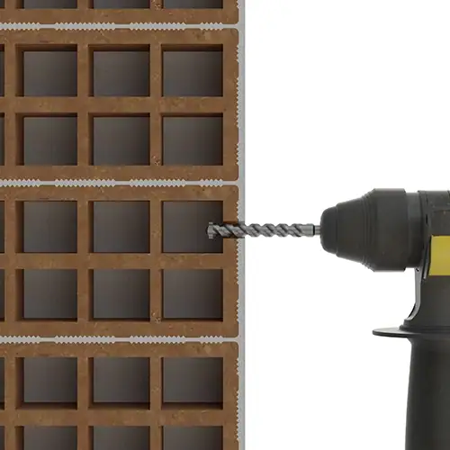 Paso 1 perforación del ladrillo hueco con taladro percutor